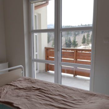 Hospital room in the background of windows and mountains