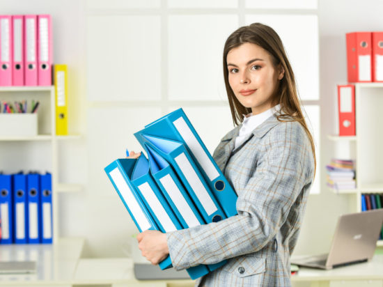 Girl businesswoman with documents. Administrator secretary. Office worker. Formal fashion. Woman hold office folder. College university student. Responsible trainee. Cute shy woman in jacket.